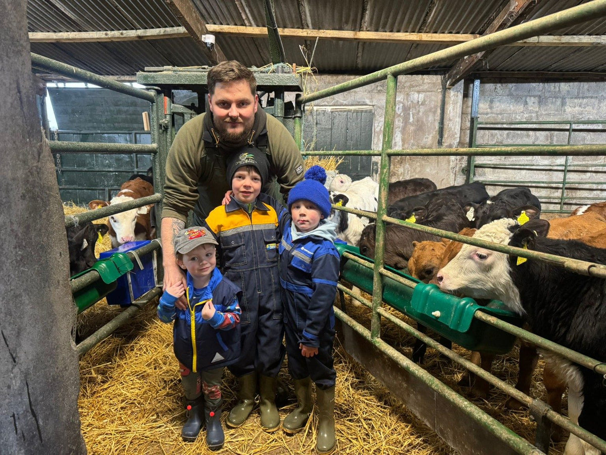 Jason and the kids in the calf shed